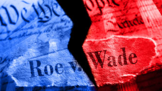 The constitution ripped in two. One side colored red the other blue. With the words Roe v. Wade superimposed over the image.